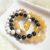 Amber, white coral & brass bracelet