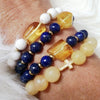 Amber, white coral & brass bracelet