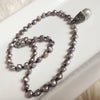 Pave crystals & Pearl drop on a strand of iridescent grey freshwater pearls and onyx necklace